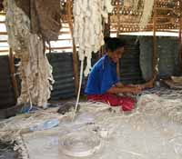 Ladies weaving rugs